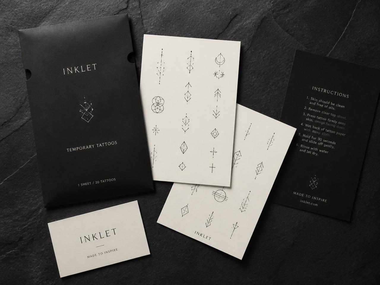 Temporary tattoo sheets with minimal black and bone packaging